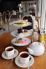 afternoon hitea tower with various delicious cake