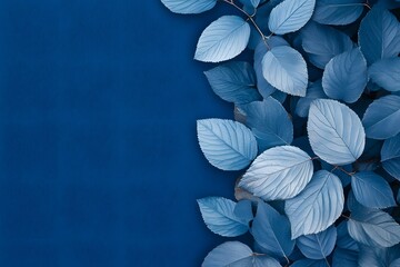 Blue leaves border on textured background, copy space, nature design