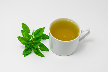 Peppermint tea in a white cup