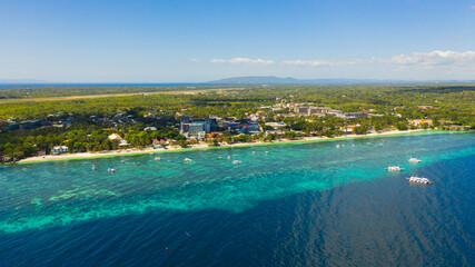 Fototapeta premium Beautiful Alona beach and blue sea in Panglao island, Bohol, Philippines. Holiday and vacation concept. Tropical beach.