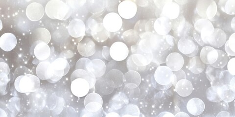 Abstract silver bokeh background with scattered soft white and light gray circles creating a dreamy atmosphere ideal for festive themes.