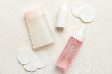 Micellar cleansing water and discs to remove cosmetics and cleanse the skin on colored background. Copy space top view