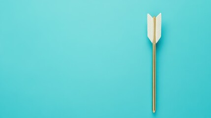 A minimalistic image of a golden arrow against a bright turquoise background, representing focus and direction.
