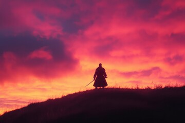 Silhouette of a swordsman on a hill during a fiery sunset, dramatic backdrop