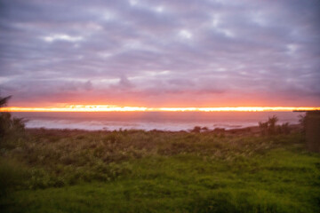 Sunrise over the ocean located at a area called Orange Rocks in Uvongu, Margate, South Africa. 