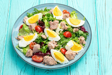 Canned Tuna salad with eggs and tomatoes photography . Top view