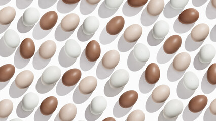 Pattern of Brown and beige Eggs with sun shadows, minimal style aesthetic holiday banner, natural organic chicken eggs, breakfast ingredients,  minimalist food composition, neutral colored