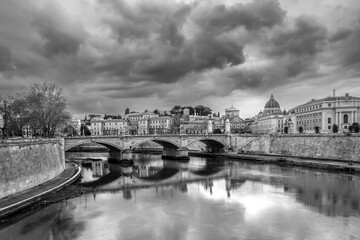 view of St. Peter Basilica in Rome from Tiber river in black and white