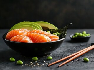 A vibrant bowl of sushi featuring salmon slices, avocado, and edamame, elegantly presented with chopsticks on a dark, textured surface.