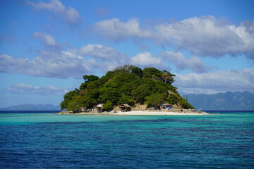 Naklejka premium Tropical beach with coconut palm trees and sea on the island Palawan at the Philippines