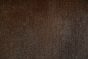 Subtle texture of dark brown fabric highlighting its soft appearance and quality