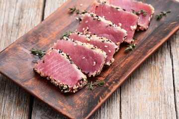 Sliced tuna steak with sesame photography . Top view