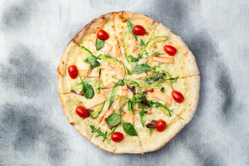 Italian pizza with avocado salmon  tomatoes and mozzarella photography. top view