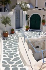 Whitewashed houses with terraces and a beautiful view in Oia on Santorini island, Greece