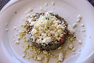 Quinoa with goat cheese and sprouts. Healthy food