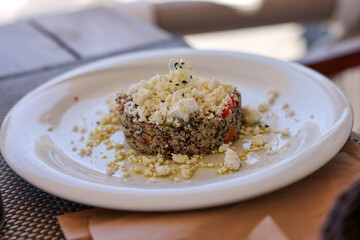 Quinoa with goat cheese and sprouts. Healthy food