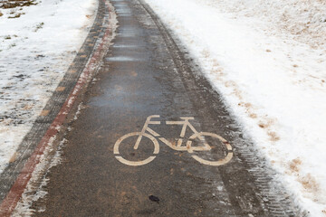 Bicycle path in the city during winter. cycling in the city in winter. Selective focus