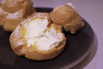 Closeup of Mouthwatering French Cream Puffs or Choux a la Creme 