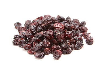 A small pile of dried cranberries featuring glossy textures, wrinkled surfaces, and deep red tones, isolated on a white background