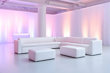 White sofa and ottoman in a softly lit room, ideal for staged event seating