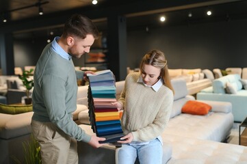 Married couple in the shop choosing furniture