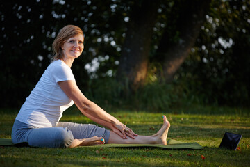 Pilates, stretching and tablet with woman for portrait, online class and live streaming or video...