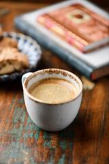 Cup of coffee and Cantuccini (Italian cookie) on dark wooden background. Copy space.	