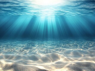Underwater sunbeams on sandy seabed