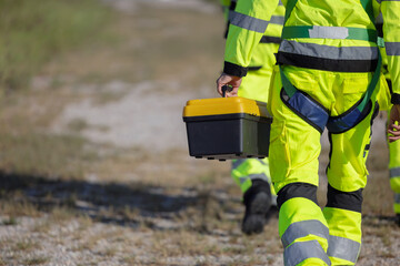 engineer hand holding toolbox at wind turbine field