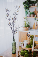 Elegant spring decor with greenery and natural elements in a cozy kitchen