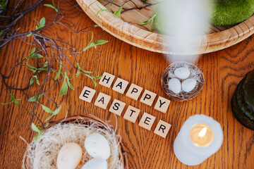 Decorated table centerpiece for Easter celebration with eggs and candles
