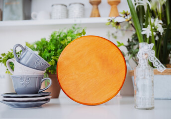 Beautiful kitchen display with wooden board and elegant tableware arrangement