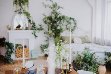 Cozy interior with plants and candles creating a warm atmosphere for relaxation