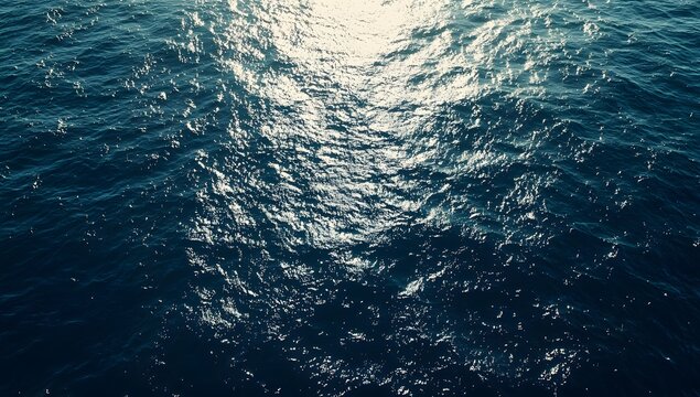 High-angle view of ocean water surface, sunlight reflections
