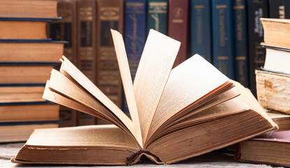 Naklejka premium Old books in a library . Education background