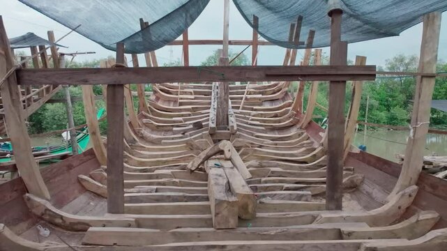 Traditional wooden boat building in Indonesia. The construction of wooden ship in Indonesia