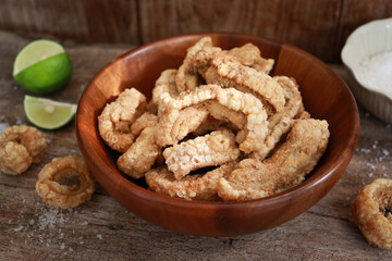 Bowl of crispy pork cracklings or pork rind. Asian food appetizer.