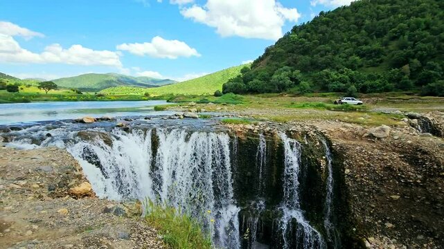 Natural waterfall in lush Marivan: cascading water over rocks into a serene pool.
📍Marivan - Kurdistan  