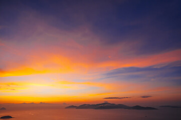 sunset cloudscape Panoramic with rich purple and pink tones blending into orange at horizon, twilight backdrop