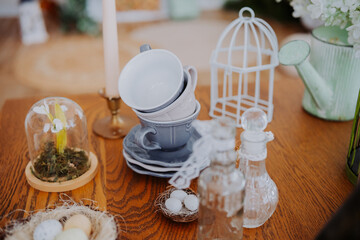 Charming vintage cups and decor create a cozy table display