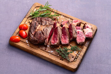 Ribeye grilled  beef steak sliced . Rare doneness photography . Top view