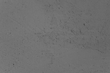 Concrete surface with textured patterns in a monochromatic gray tone