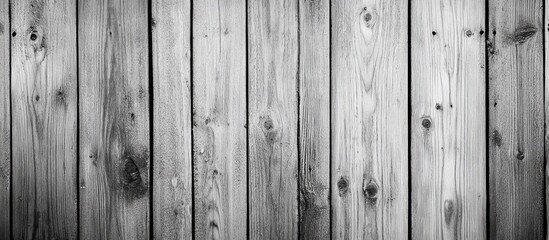 Fototapeta premium Aged gray wooden boards create a rustic charm with a weathered texture. The vertical planks enhance the timeless appeal of the natural wood tones.