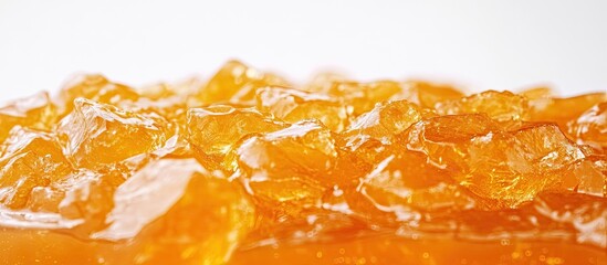 Ginger jam in rich amber hues displayed against a plain white background highlighting texture and vibrant color for a mouthwatering appeal