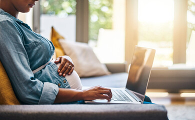 Woman, pregnant and hands with laptop in home, prenatal website and reading information on baby....