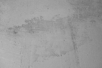 Surface texture featuring subtle patterns and marks in neutral tones