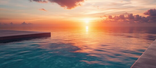 Aerial view of a luxurious infinity pool overlooking a tranquil ocean sunset, with vibrant orange and purple hues enhancing serene ambiance.