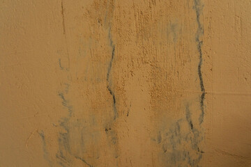 Texture of beige wall with subtle blue veins in artistic design