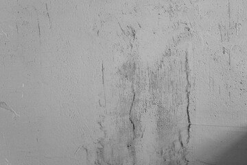 Textured grey wall with subtle variations in tone and surface detail