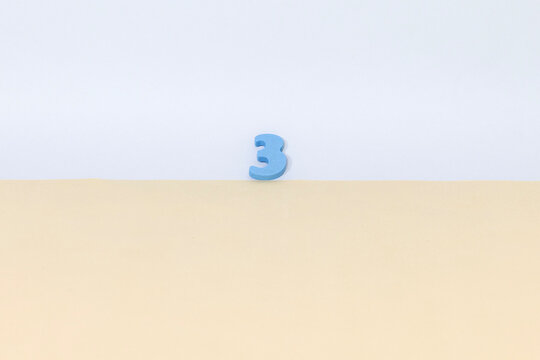 wooden numbers on colorful background.